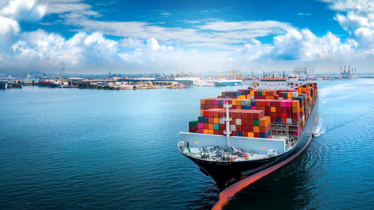 aerial-side-view-of-cargo-ship-carrying-container-and-running-for-export.jpg